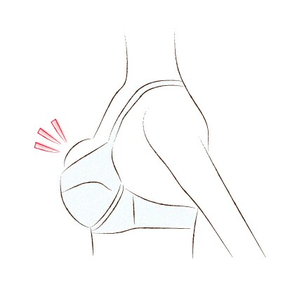胸がブラの上側にはみだす。